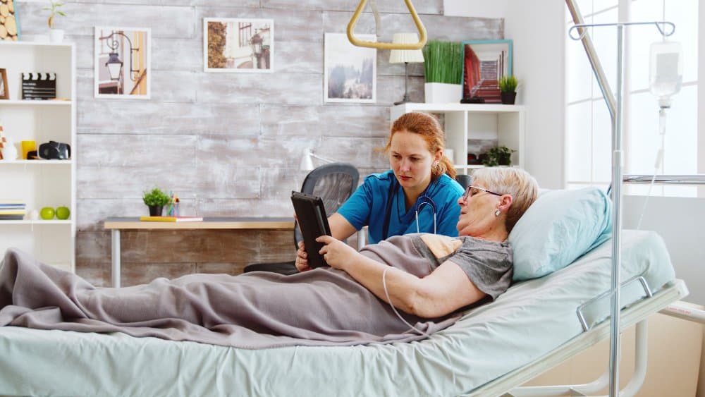 Care worker supporting an older adult at home